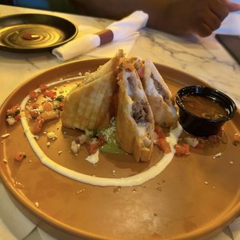 La Buena Vida Raleigh signature dishes Birria RollsEnchiladas ChipotleCarnitas Plate